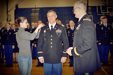 Hall being promoted to Lt. Col. by his daughter Samantha and Maj. Gen. Francisco.