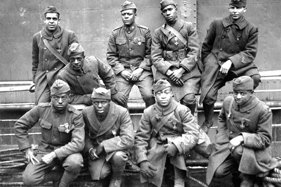Soldiers of the 369th (15th N.Y.) who won the Croix de Guerre for gallantry in action, 1919. Front row: Pvt. Ed Williams (left), Herbert Taylor, Pvt. Leon Fraitor, Pvt. Ralph Hawkins. Back Row: Sgt. H. D. Prinas, Sgt. Dan Storms, Pvt. Joe Williams, Pvt. Alfred Hanley, and Cpl. T. W. Taylor.