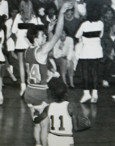 Mr. Paul Adas makes a jump shot at one of his high school games.