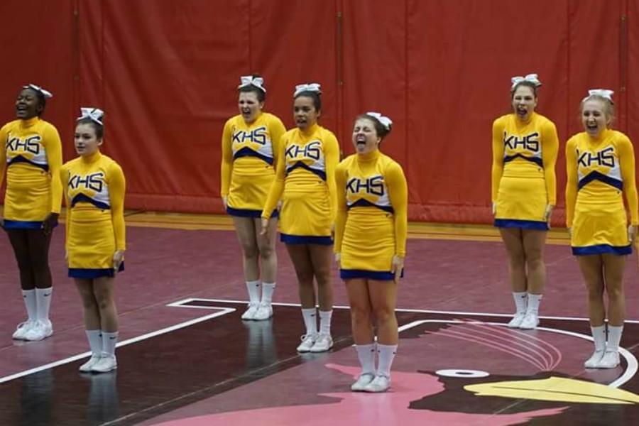 Cheerleaders get ready to tumble during round two at Davison on Saturday, Jan. 16. 