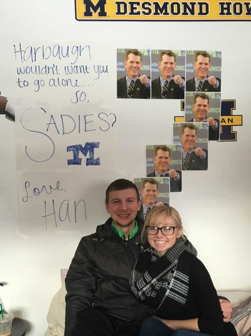 Senior Hannah Coon asks Tyler Schwerin, senior, to the Sadie Hawkins dance with a poster featuring the University of Michigan head football coach Jim Harbaugh.  