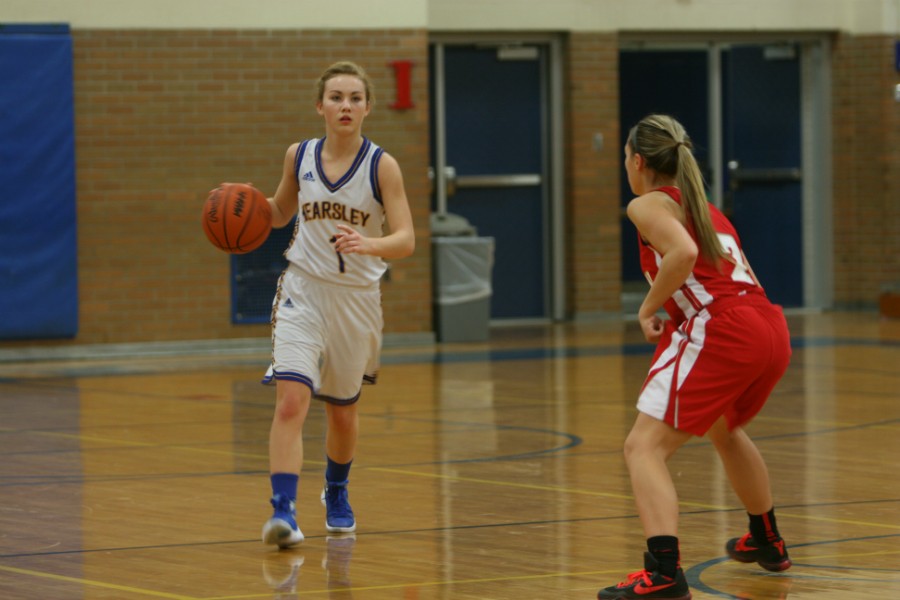 Senior Diane Bond brings the ball up the court against Holly on Tuesday, Feb. 2.  Bond scored eight points.