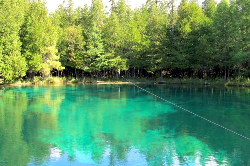 The Kitchitikipi natural spring has beautiful colors. It is in Palms Book State Park, which is in Manistique.
