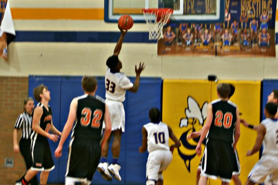 Senior Deitrick Young shoots a layup in the third quarter against Fenton on Friday, Feb. 12.