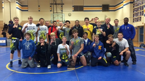 The wrestling team celebrates its district championship Wednesday, Feb. 10 at Kearsley. The team takes on Owosso at its regional meet Wednesday, Feb. 17, in Mt. Pleasant.