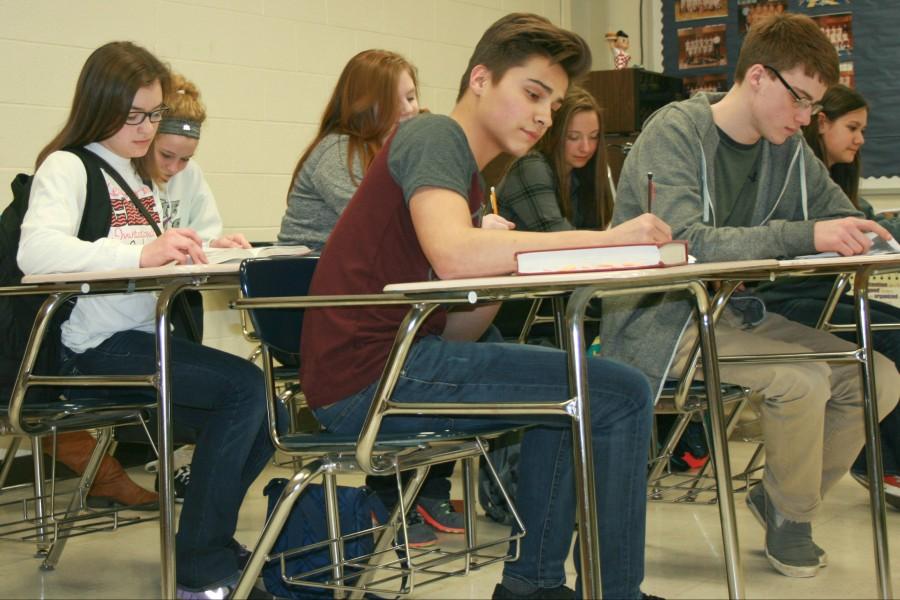Students in Mr. Paul Adas junior AP English class work on SAT review. The students in the forefront are Kassidy Krist (left), Neil Kagerer, and William Spielmaker.