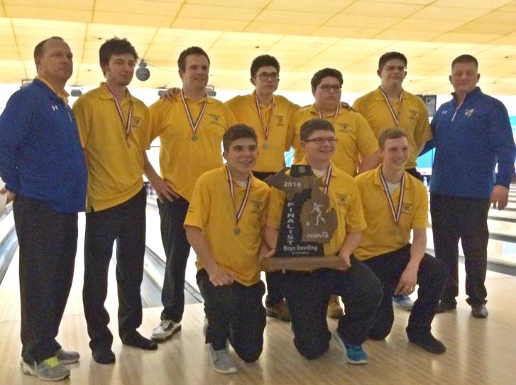 The boys bowling team poses with its finalist trophy from the D2 state final.