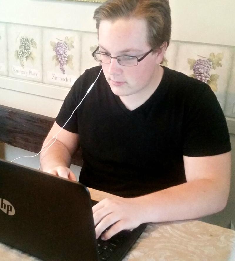 Senior Jacob DePottey types an essay to pass time on the snow day. 