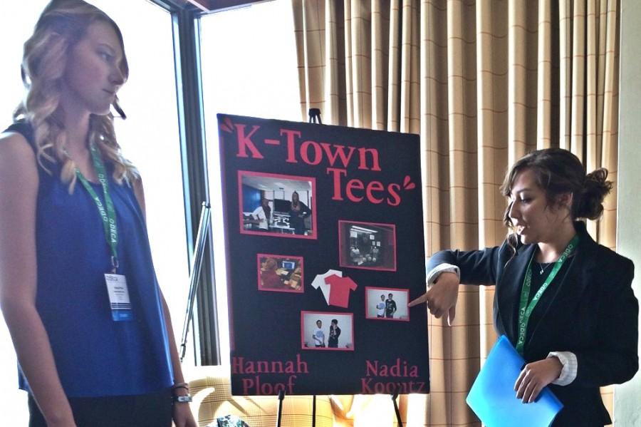 Seniors Hannah Ploof (left) and Nadia Koontz practice their DECA presentation in the hotel room. The girls were state finalists for their presentation at the Michigan DECA conference Friday and Saturday, March 11 and 12, in Detroit.