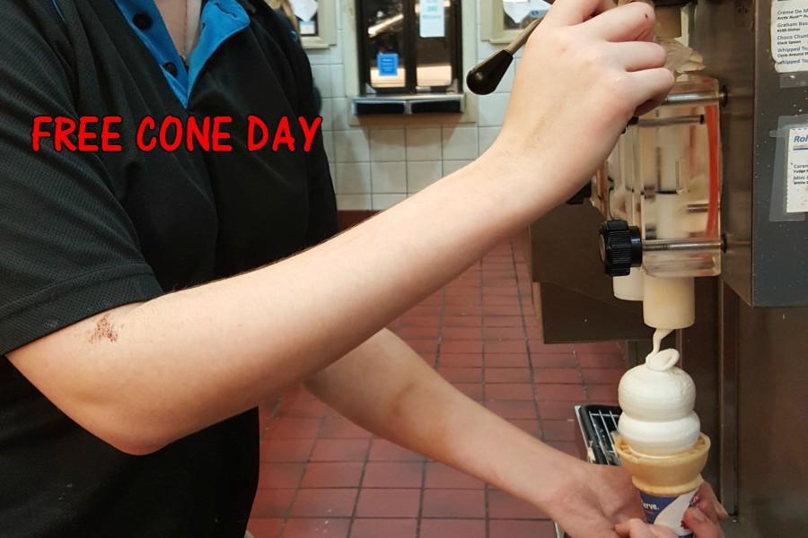 A Dairy Queen employee practices making her cones in preparation for Free Cone Day. 