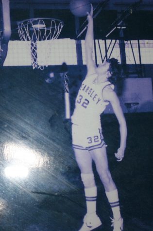 Ed Councilor, history teacher, goes up for a dunk.