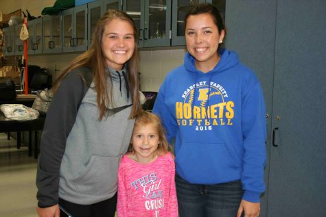 Lila Nester met some of her dad's students, seniors Colleen Desrochers and Bri Finley.