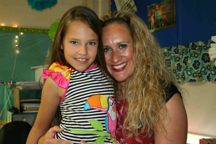 Mrs. Colene Wilcox and her daughter Adelynn hang out on take your child to work day Thursday, April 28.