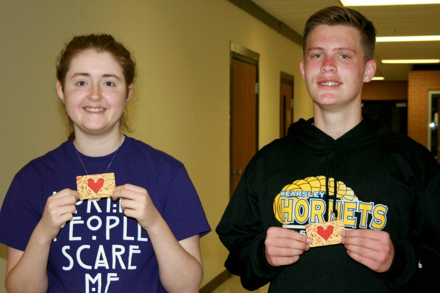 Senior Kayla Smith (left) and freshman Hunter May pose with their gift cards after having the top two student brackets in The Eclipse March Madness Bracket Challenge. 