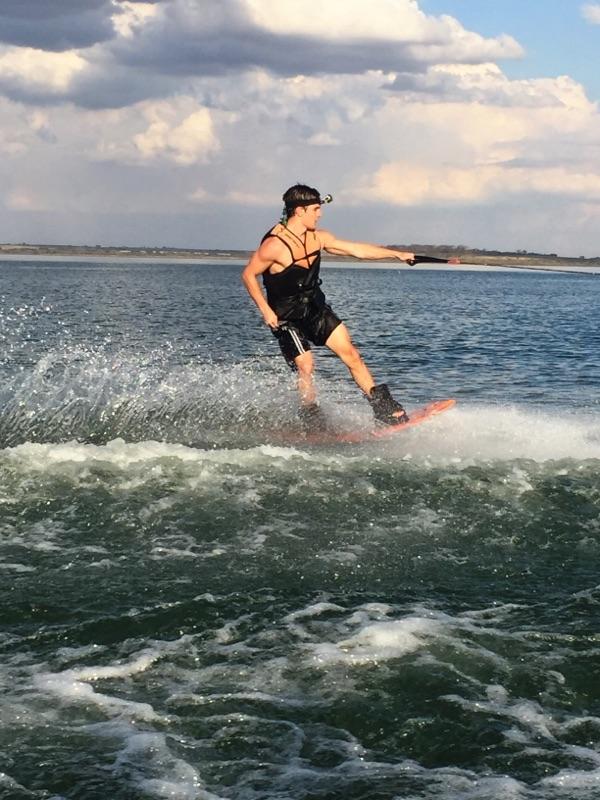 Senior Igor Guerra rides his wake board while filming with his GoPro. 