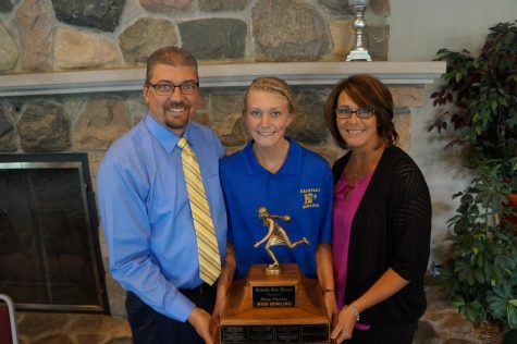 Senior Hannah Ploof holds her newest award, Miss Bowling 2016, with her parents, Mr. Robert Ploof and Mrs. Pam Ploof