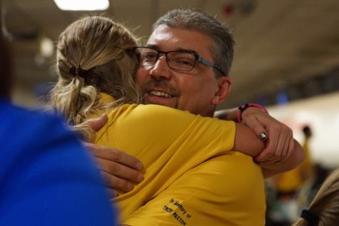Senior Hannah Ploof hugs her dad, Mr. Robert Ploof, after winning the team state championship.