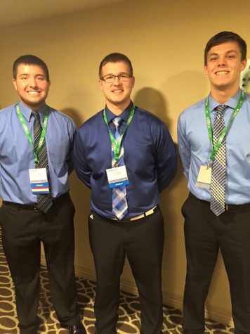 Seniors Noah Jankowski (left), Tyler Phipps, and Liam Grathoff get ready to compete at DECA states in Detroit.