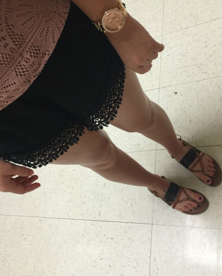 Sophomore Makalia Jenkins wears loose shorts, and sandals 