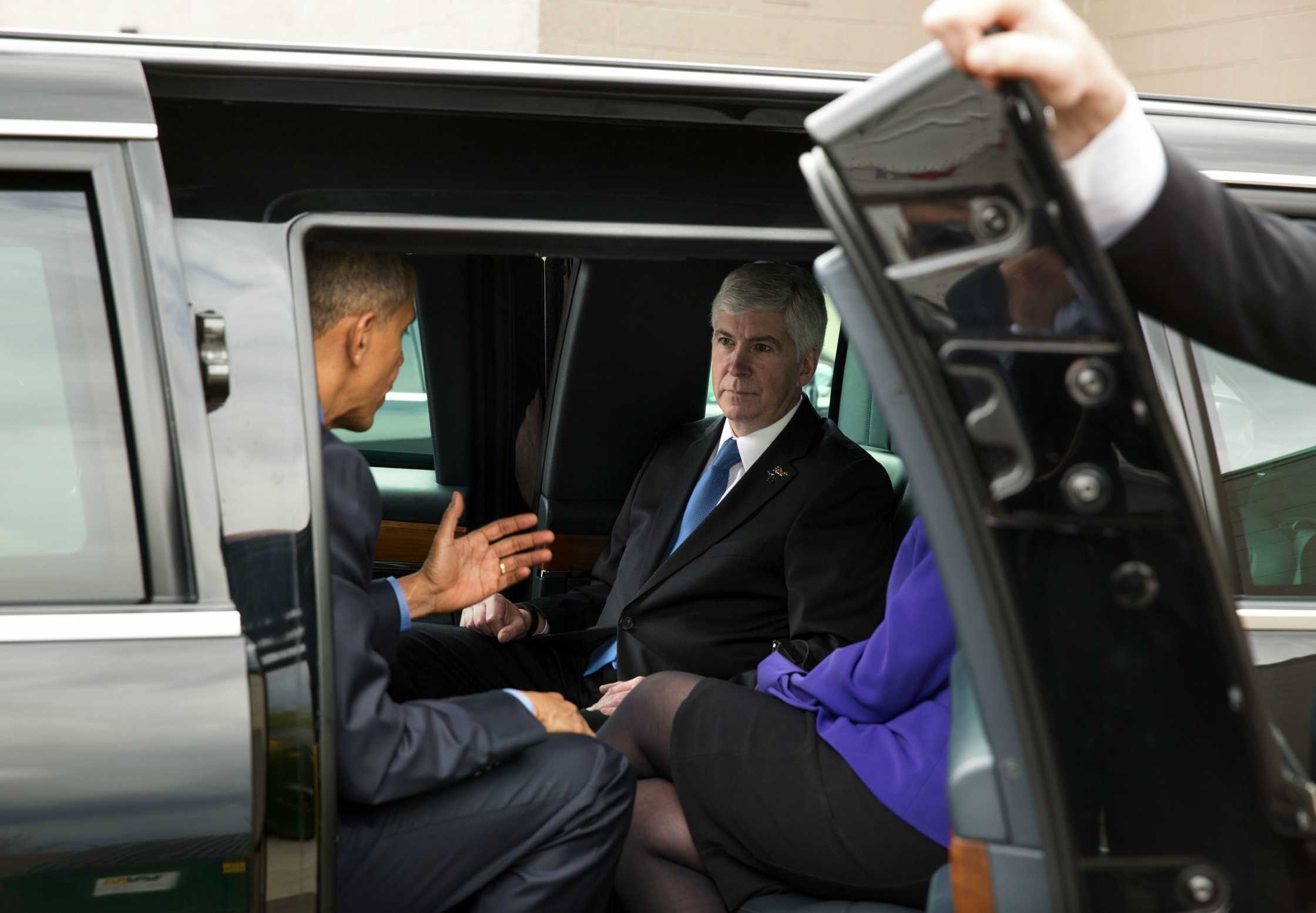 President Barack Obama talks with Gov. Rick Snyder as they arrived at Food Bank of Eastern Michigan in Flint on May 4, 2016. The governor rode in the motorcade with the President from the airport.