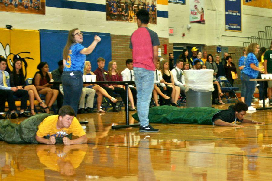 Freshman Matt McGinnis (left) and sophomore Saif Dawan prepare to race in sleeping bags during the pep assembly Monday, Oct. 3.