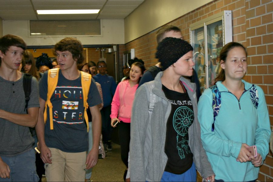 Students walk the 300 Hallway after getting out of lunch.