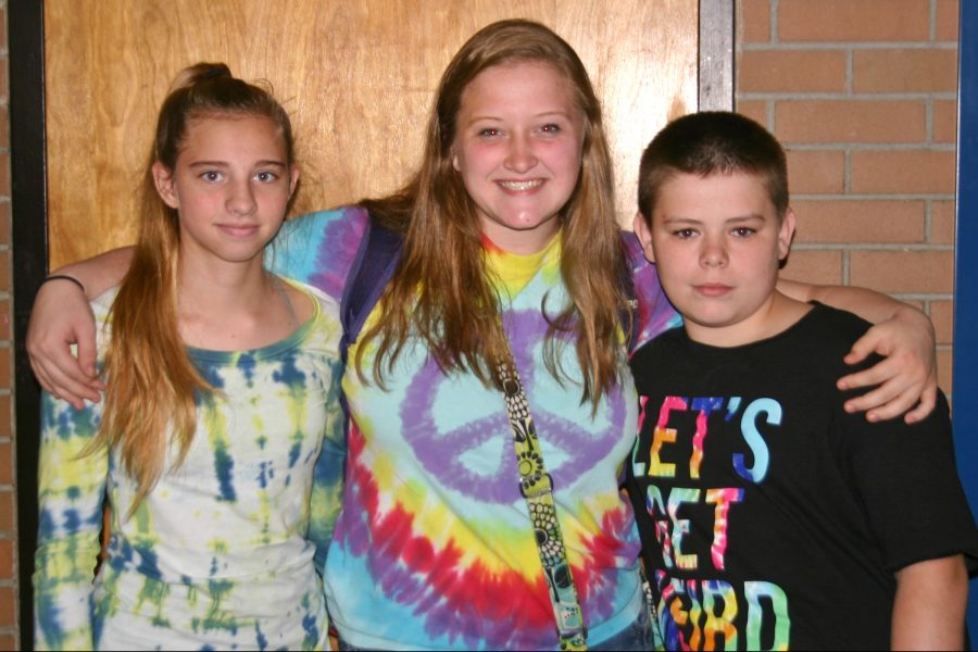 Freshman Molly Taber (l to r), sophomore Mary Wheeler, and freshman Ryan Lamb dress up for tie-dye Tuesday.