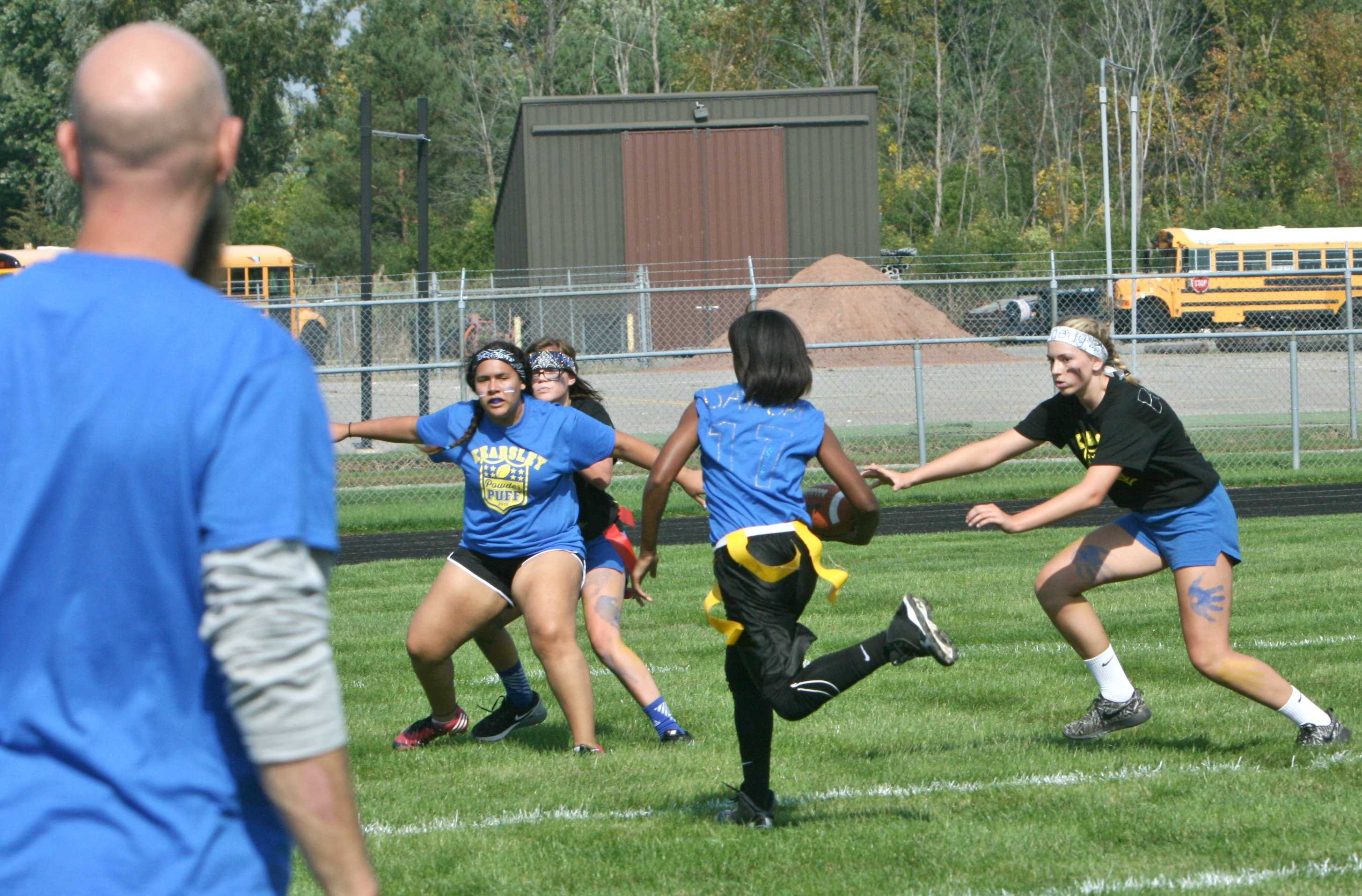 Senior Dajiana Simmons runs 5 yards for the winning touchdown while Tori Jones clears the path for her.