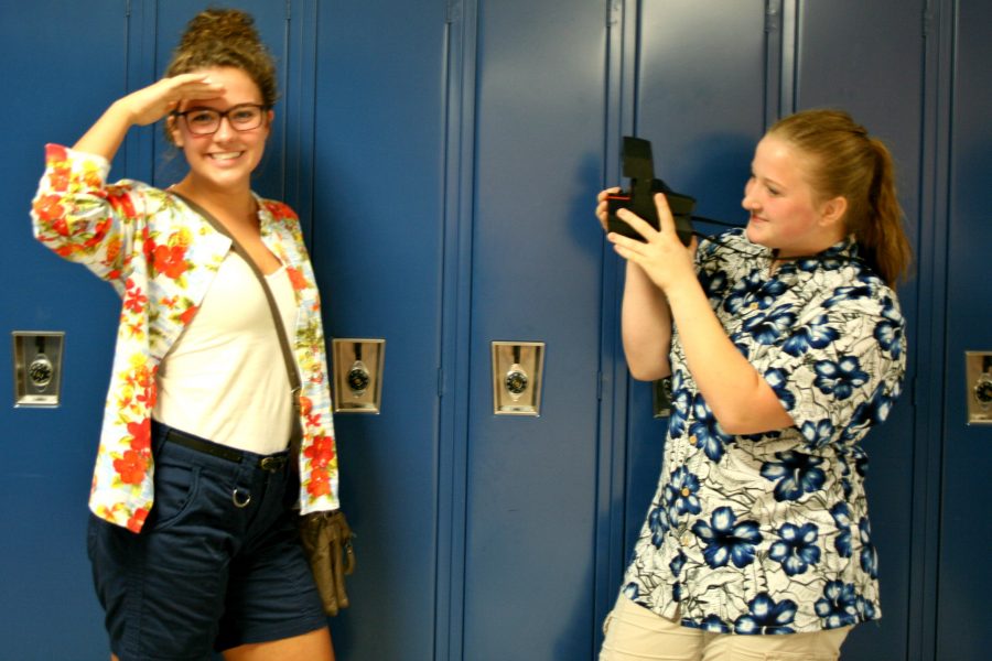 Sophomore Mary Wheeler (right) takes a tourists photo of sophomore Chloe Vollmar for Tourist Thursday. 