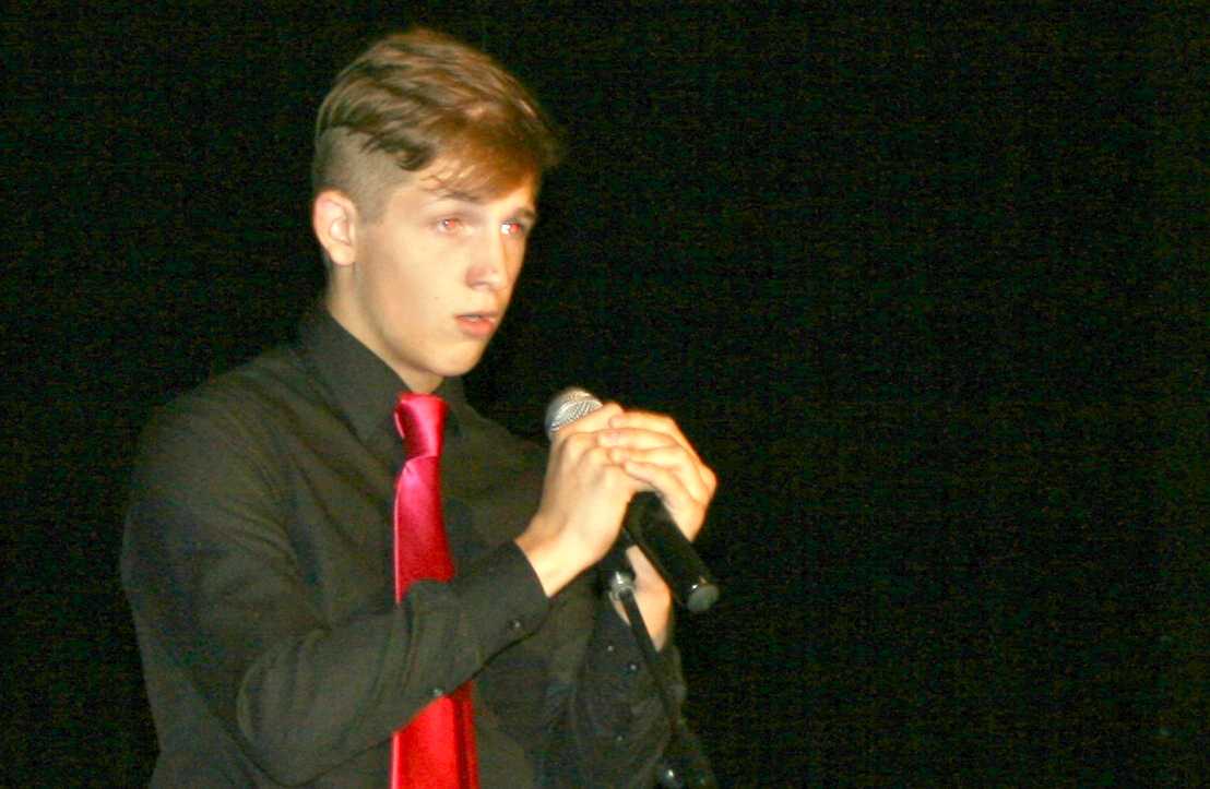 Junior Sebastian Young sings "Fly Me to the Moon."