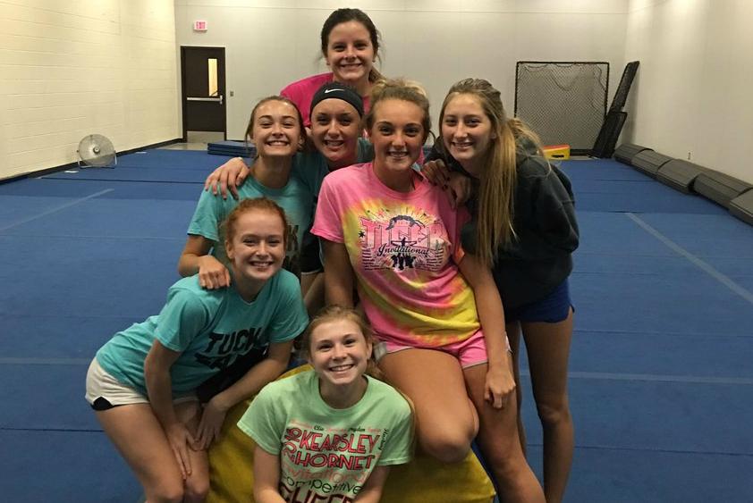 Members of the cheer team take a break at practice. Tryouts for this year are Monday, Nov. 7.