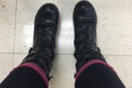 Senior Kaitlyn Alburtus wears black combat boots and boot socks at school.