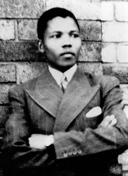 Nelson Mandela, 19, leans against a brick wall in Umtata in 1937. Today Umtata is known as Mthatha in South Africa.
