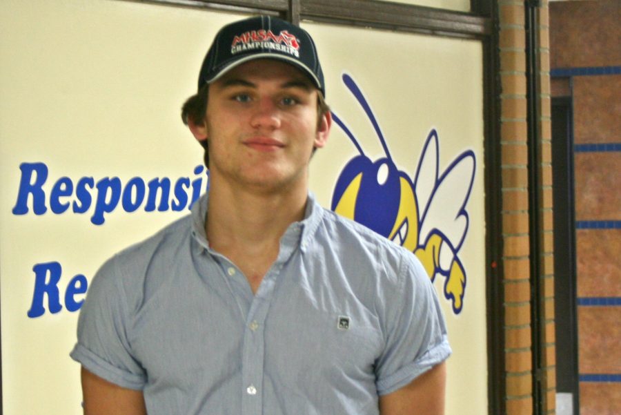 Senior Dylan Tarrence proudly showcases his MHSAA championship hat after winning a Division 2 individual regional wrestling title on Saturday, Feb. 18, at Marysville.