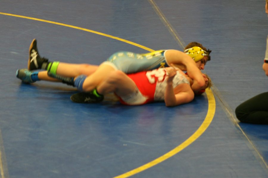 Freshman Trenton DiGenova overpowers his Swartz Creek opponent in a match at Kearsley on Jan. 18. DiGenova won his match against Clio on Wednesday, Jan. 25, to help the Hornets defeat the Mustangs.