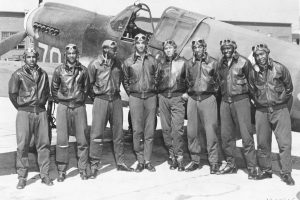 The Tuskegee Airmen pose in front of one of their fighter aircraft in this photo from 1942 or 1943.