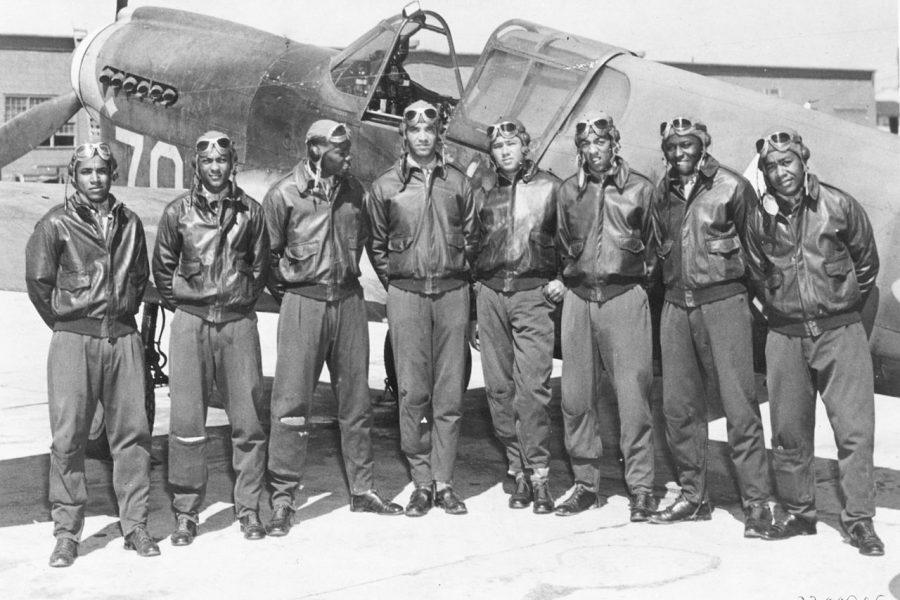 The+Tuskegee+Airmen+pose+in+front+of+one+of+their+fighter+aircraft+in+this+photo+from+1942+or+1943.