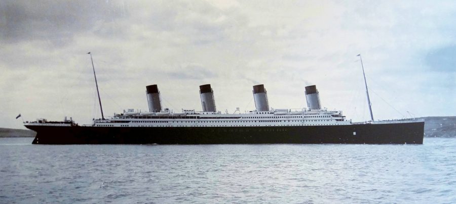 The Titanic was 882 and a half feet long, and 45,000 tons. it carried around 2,200 people during its maiden voyage. 
