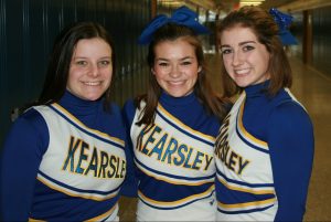 Seniors Madison Teed (l to r), Kassidy Krist, and Hailey Baltosser are excited to compete for the first time at the MHSAA Division 2 cheer state final on Saturday, March 4.