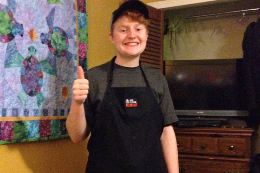 Sophomore Chloe Clark poses in her Taco Bell work uniform.
