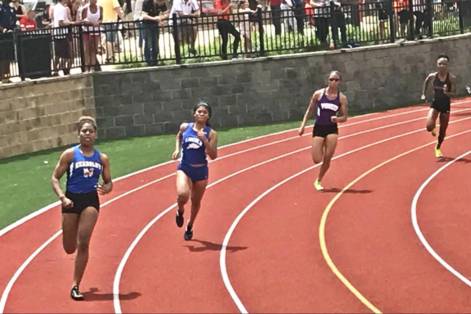 Senior Aver McKay (left) runs the 400-meter dash in Heat 2 of the MHSAA Division 1 state final at East Kentwood on Saturday, June 3.