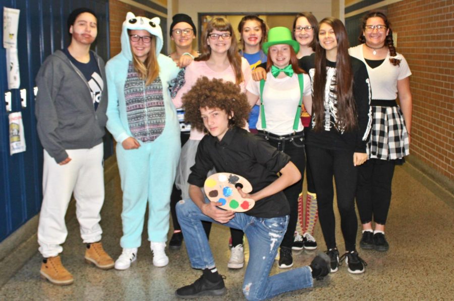 Freshman group together to show off their Halloween costumes.