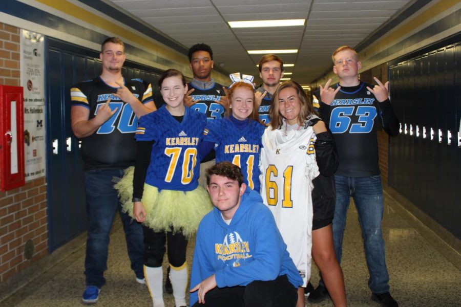 These students show of their blue and gold spirit: seniors Brandon Gibson, (back row, l to r) Charles Wilson, Cameron Adle, and Collin McNew; seniors Gabby Ropp (middle, l to r), Desirah Richards, and Emma Boychuck; and senior Evan Stimac is in the front row.
