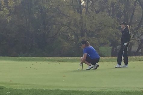 Senior Grace Hoffman (left) lines up a putt at the Bedford Valley Golf Course during the D2 MHSAA state final. The final was Friday, Oct. 20, and Saturday, Oct. 21, in Battle Creek. Hoffman tied for 28th place.