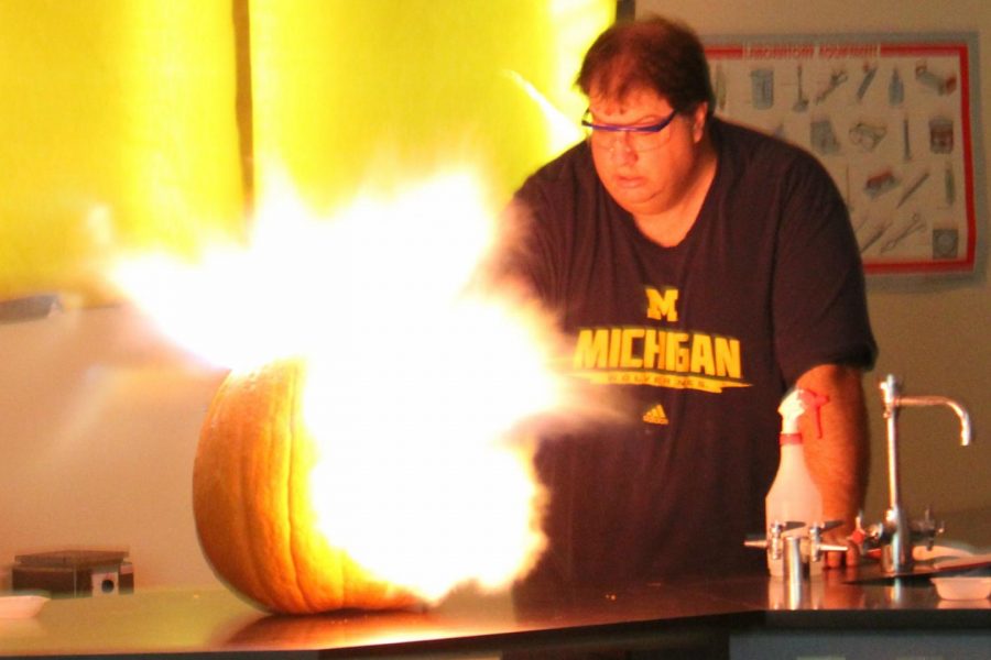 Mr.+Kelly+Christian+blows+up+a+pumpkin+in+his+physics+class+on+Tuesday%2C+Oct.+31%2C+in+conjunction+with+Halloween.