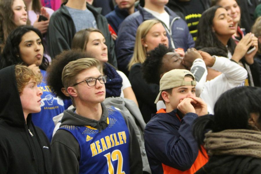 Students in The Hive cheer on the Hornets at a boys basketball game against Flushing on Tuesday, Dec. 12. Kearsley lost to Flushing 56-43.