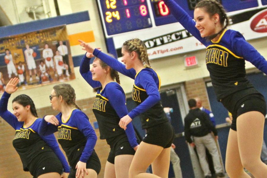 The dance team pumps the crowd up during the Kearsley vs. Flushing basket ball game.