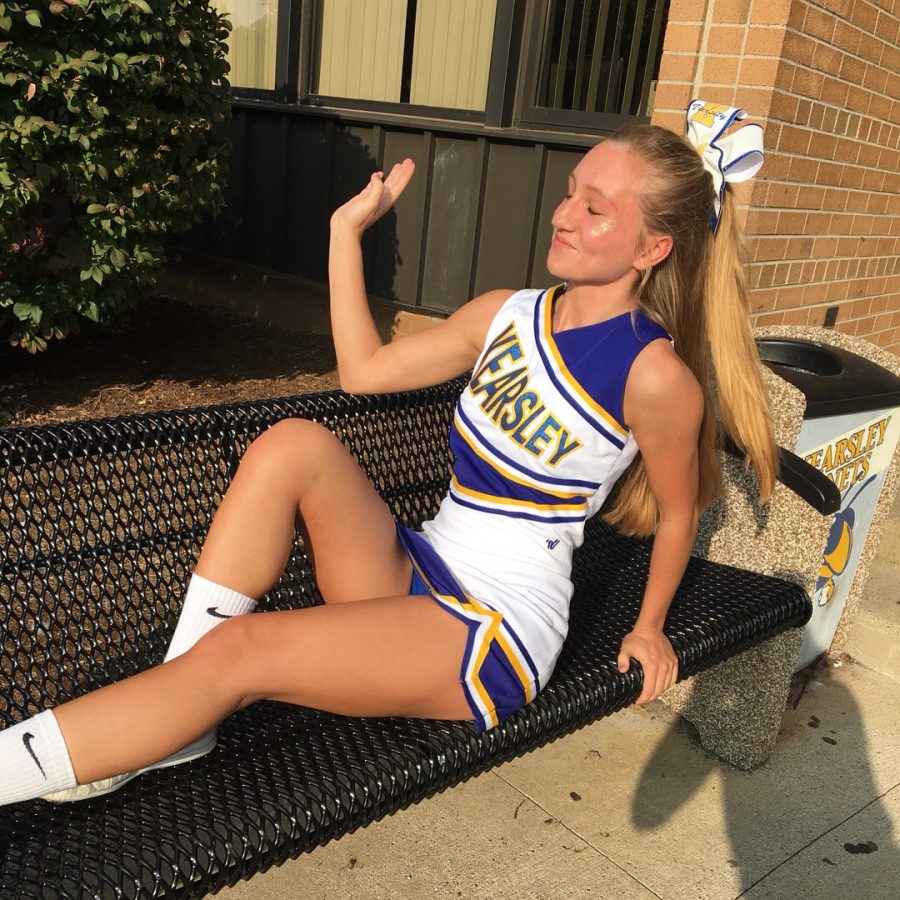 Amanda flips her hair for the camera before a football game. 