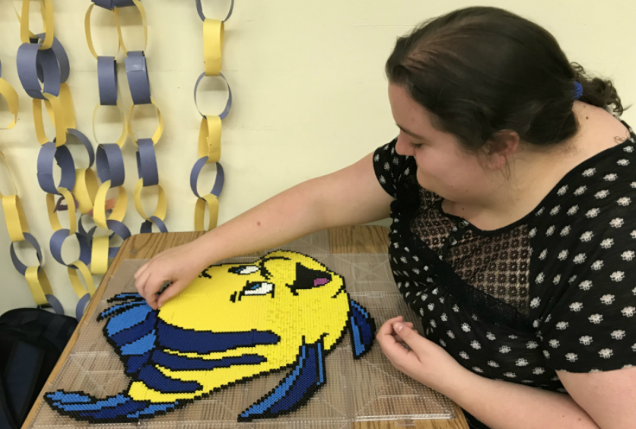 Senior Annie Marland works on one of her art projects in Studio Art.