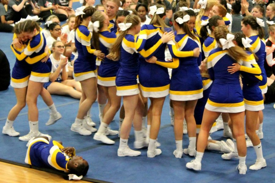 After hearing the final scores of the jamboree, the cheer team celebrates its league championship Wednesday, Feb. 7, at Kearsley.